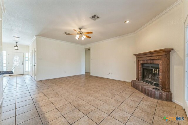 3302 Colorado Dr, Copperas Cove, TX 76522 - unfurnished living room featuring a ceiling fan, baseboards, light tile patterned floors, crown molding, and a brick fireplace