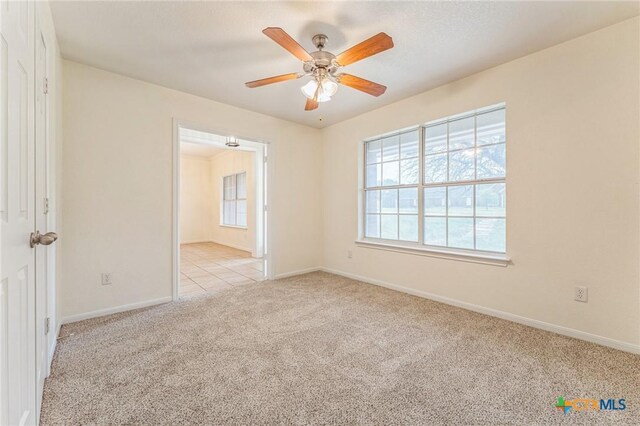 3302 Colorado Dr, Copperas Cove, TX 76522 - carpeted spare room featuring baseboards and a ceiling fan
