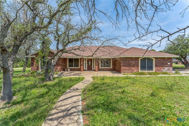 3302 Colorado Dr, Copperas Cove, TX 76522 - ranch-style house featuring brick siding and a front lawn
