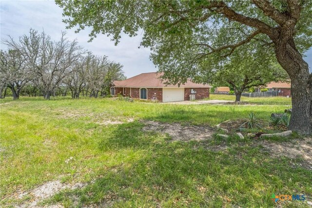 3302 Colorado Dr, Copperas Cove, TX 76522 - view of yard with a garage