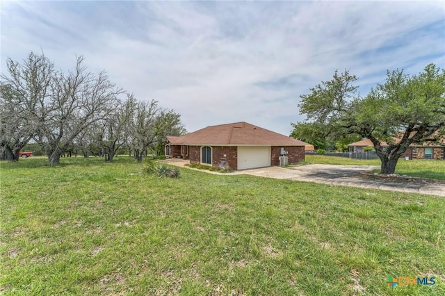 3302 Colorado Dr, Copperas Cove, TX 76522 - view of property exterior with driveway, a garage, a lawn, and brick siding