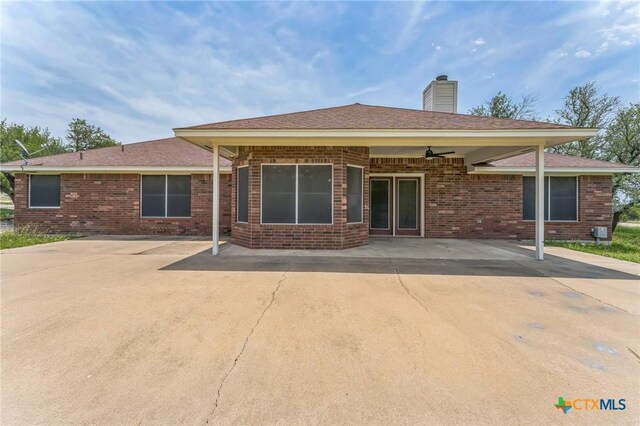 3302 Colorado Dr, Copperas Cove, TX 76522 - rear view of property featuring brick siding, a chimney, and ceiling fan