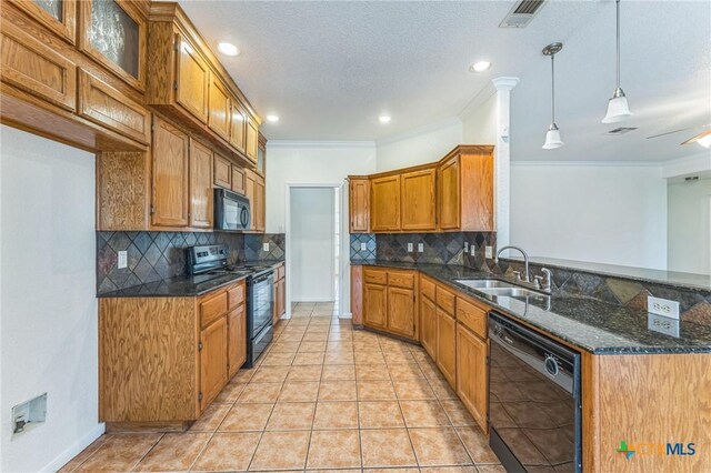 3302 Colorado Dr, Copperas Cove, TX 76522 - kitchen with black appliances, a sink, crown molding, brown cabinetry, and a peninsula