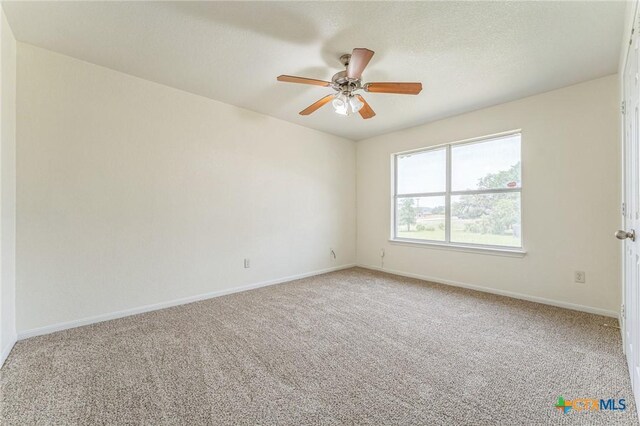 3302 Colorado Dr, Copperas Cove, TX 76522 - spare room featuring light colored carpet, ceiling fan, and baseboards