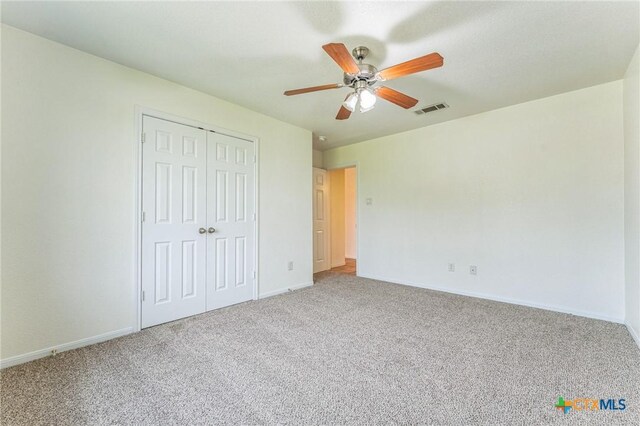 3302 Colorado Dr, Copperas Cove, TX 76522 - unfurnished bedroom featuring carpet floors, a closet, baseboards, and a ceiling fan