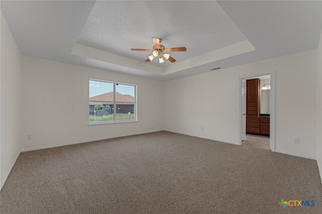 3302 Colorado Dr, Copperas Cove, TX 76522 - unfurnished room featuring a raised ceiling, ceiling fan, light carpet, and baseboards