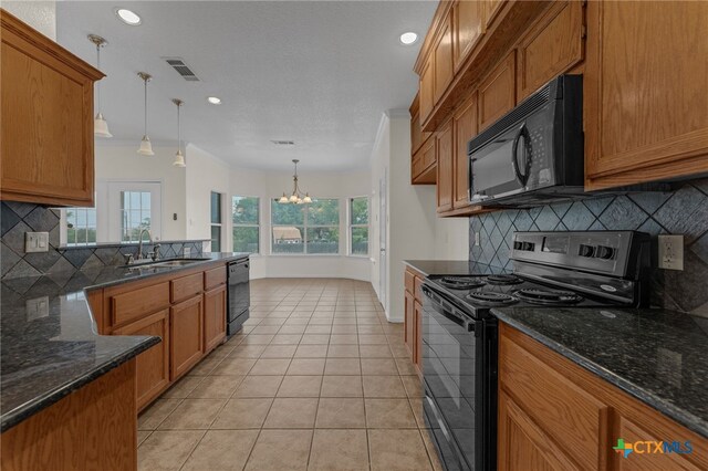 3302 Colorado Dr, Copperas Cove, TX 76522 - kitchen featuring black appliances, a sink, a chandelier, brown cabinetry, and backsplash