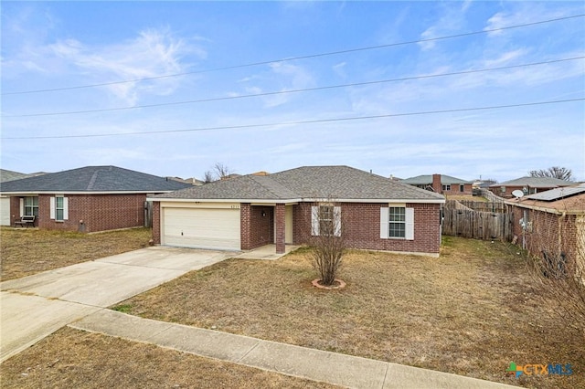 view of front of house with a front yard and a garage