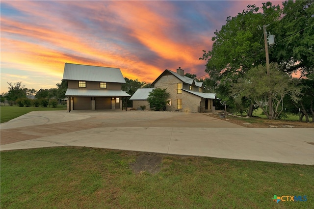 modern home featuring a yard and a garage