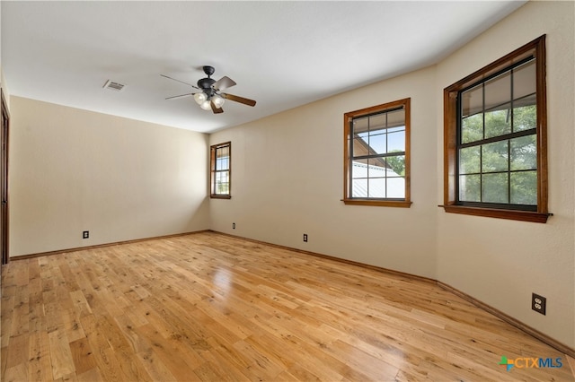 unfurnished room with light hardwood / wood-style floors and ceiling fan