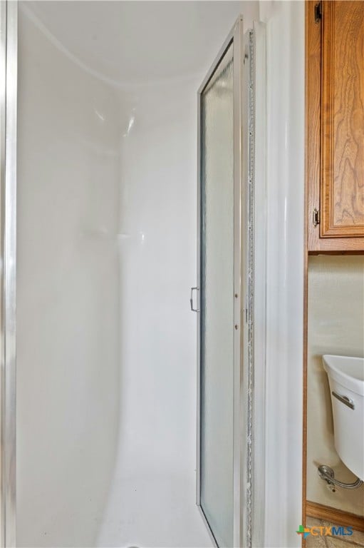 bathroom with an enclosed shower