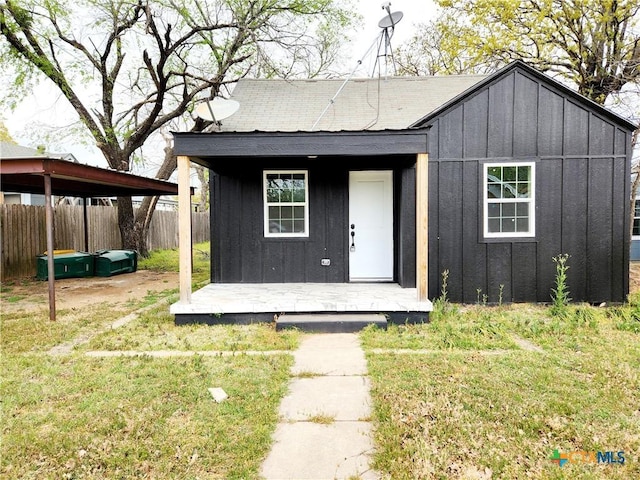 view of outbuilding with fence