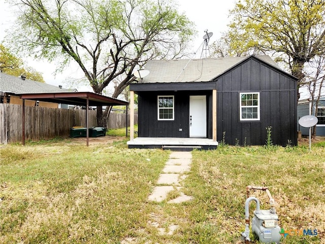 view of outdoor structure with a fenced backyard and an outdoor structure