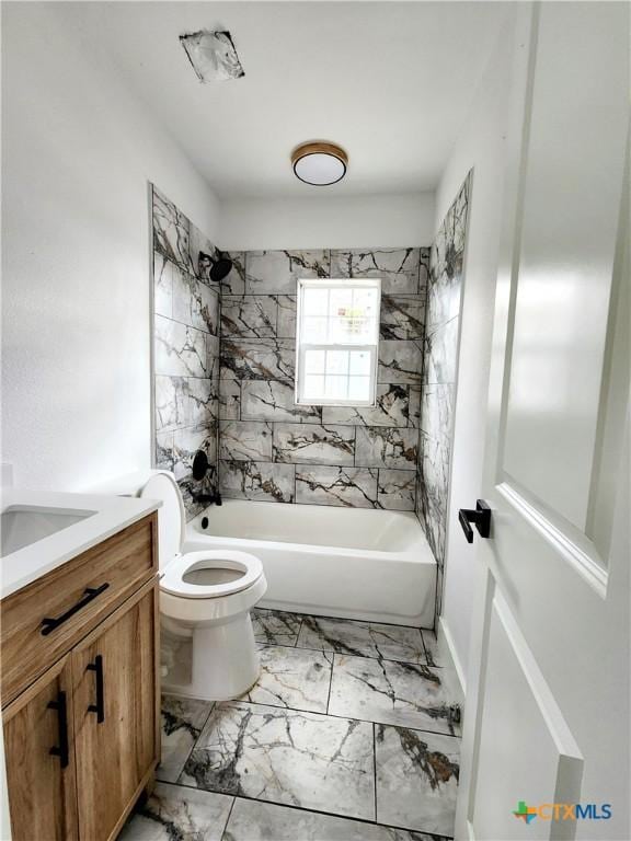 full bath featuring marble finish floor, toilet, vanity, and shower / bathtub combination