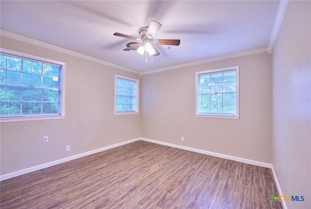 2405 Redwing Dr, Temple, TX 76502 - empty room with wood finished floors, healthy amount of natural light, crown molding, and a ceiling fan