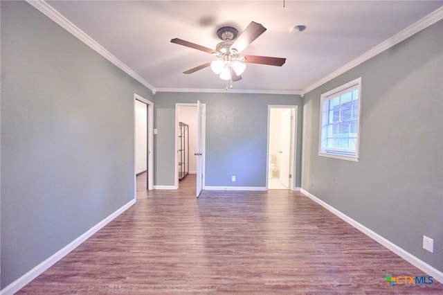 2405 Redwing Dr, Temple, TX 76502 - spare room with wood finished floors, crown molding, and ceiling fan
