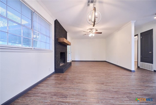 2405 Redwing Dr, Temple, TX 76502 - unfurnished living room with ceiling fan, wood finished floors, a brick fireplace, and crown molding