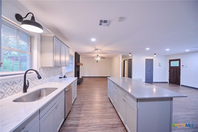 2405 Redwing Dr, Temple, TX 76502 - kitchen featuring open floor plan, recessed lighting, backsplash, wood finished floors, and a kitchen island