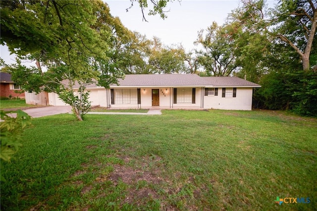 2405 Redwing Dr, Temple, TX 76502 - ranch-style home featuring concrete driveway, a front lawn, and stucco siding