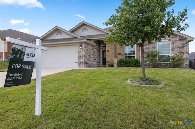 716 Kendra Dr, Temple, TX 76502 - ranch-style house with an attached garage, brick siding, a front lawn, and driveway