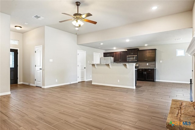 716 Kendra Dr, Temple, TX 76502 - unfurnished living room with ceiling fan, plenty of natural light, light wood-type flooring, and recessed lighting