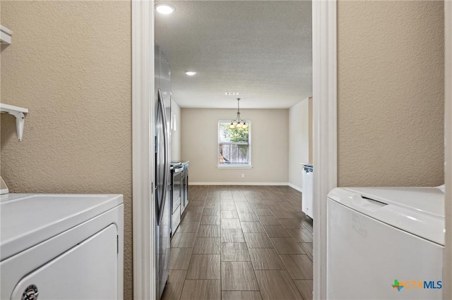 716 Kendra Dr, Temple, TX 76502 - washroom with washer and dryer, a textured wall, a textured ceiling, a chandelier, and recessed lighting