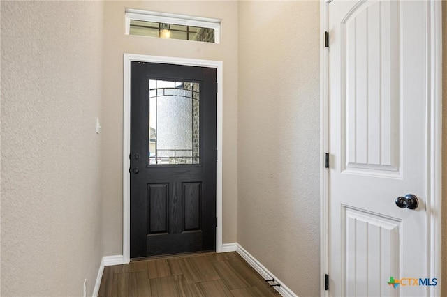 716 Kendra Dr, Temple, TX 76502 - foyer entrance with a textured wall and dark wood-style floors