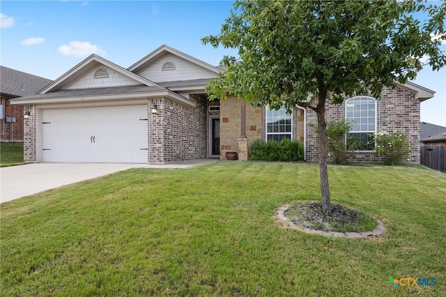 716 Kendra Dr, Temple, TX 76502 - ranch-style house featuring brick siding, a garage, a front yard, and driveway
