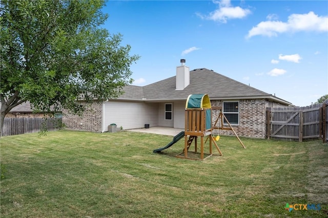 716 Kendra Dr, Temple, TX 76502 - rear view of property featuring brick siding, a fenced backyard, a chimney, and a patio