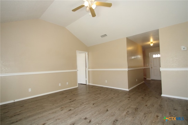 spare room featuring lofted ceiling, ceiling fan, and dark hardwood / wood-style floors