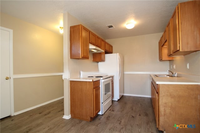 kitchen featuring white range with electric cooktop, dark hardwood / wood-style floors, sink, and a textured ceiling