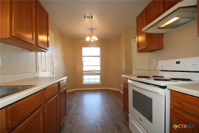 kitchen with pendant lighting, white electric range, sink, dark hardwood / wood-style floors, and a notable chandelier