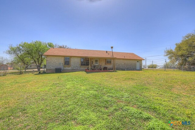 12204 Mustang Dr, Buda, TX 78610 - back of house featuring a patio area, a lawn, fence, and central air condition unit