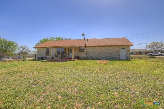 12204 Mustang Dr, Buda, TX 78610 - rear view of property with a patio area, a lawn, cooling unit, and fence