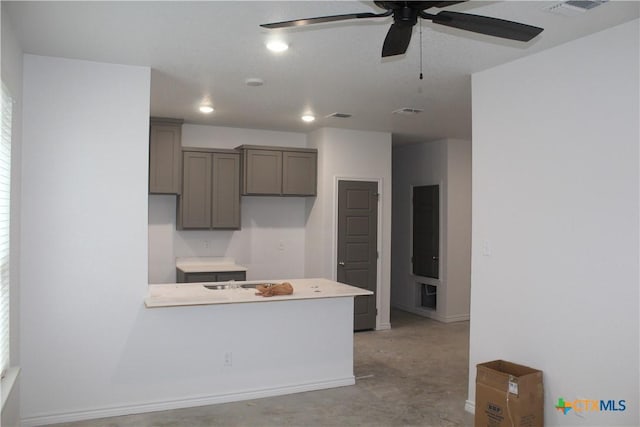 kitchen with gray cabinetry and ceiling fan