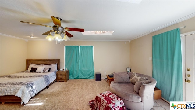 carpeted bedroom featuring ceiling fan and crown molding