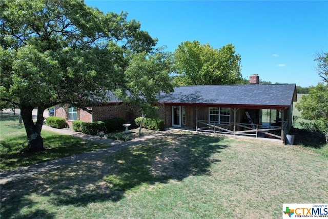 single story home featuring a front yard