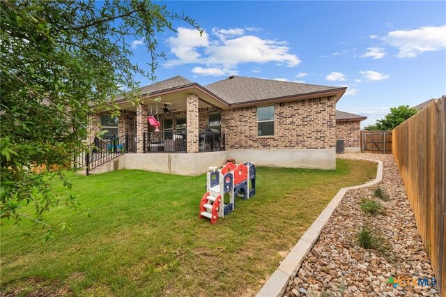 5702 Fenton Ln, Belton, TX 76513 - rear view of property featuring ceiling fan, brick siding, and roof with shingles