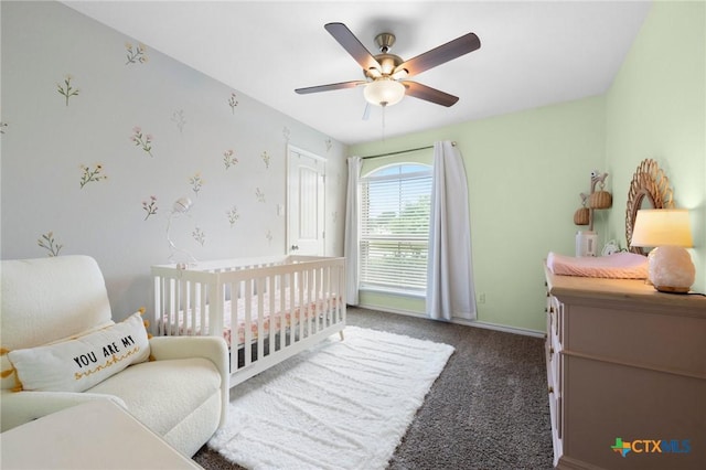 5702 Fenton Ln, Belton, TX 76513 - carpeted bedroom with a nursery area, a ceiling fan, and baseboards