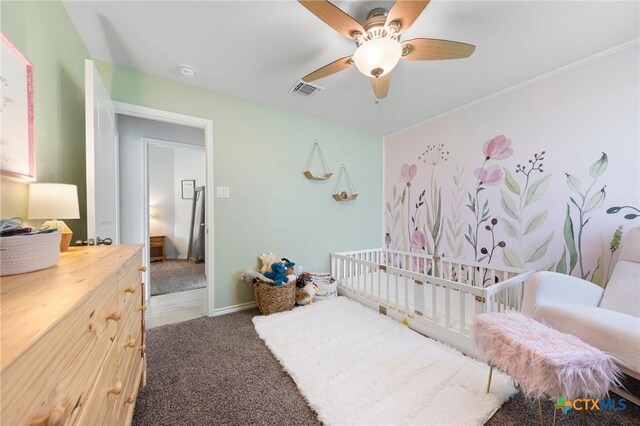 5702 Fenton Ln, Belton, TX 76513 - bedroom with carpet floors, a ceiling fan, baseboards, and a crib