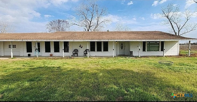 view of front of property with a garage and a front lawn