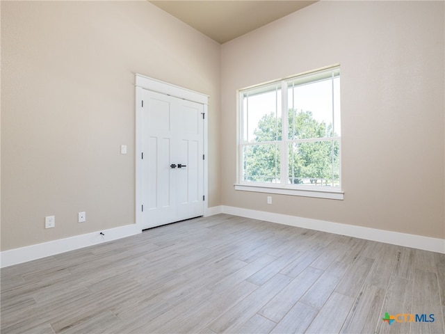 101 Dawna Len Dr, Burnet, TX 78611 - unfurnished bedroom featuring light wood-style floors and baseboards