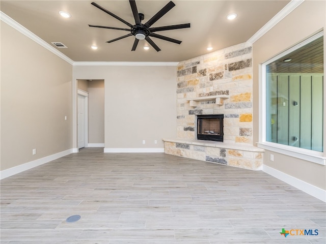 101 Dawna Len Dr, Burnet, TX 78611 - unfurnished living room with crown molding, ceiling fan, a fireplace, recessed lighting, and baseboards