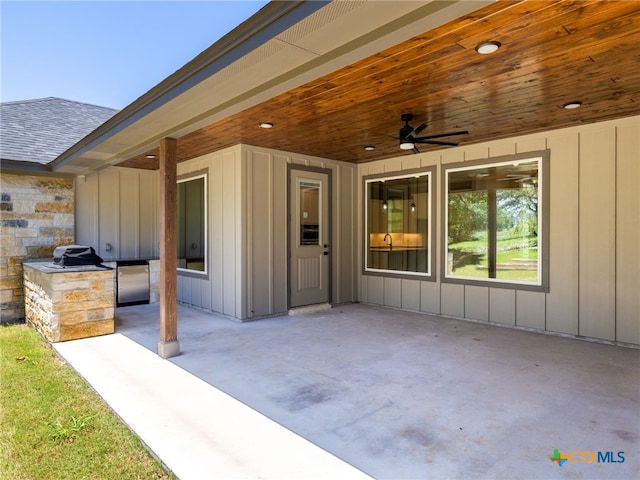 101 Dawna Len Dr, Burnet, TX 78611 - view of patio with a ceiling fan and an outdoor kitchen