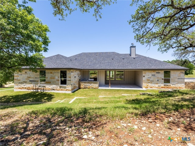 101 Dawna Len Dr, Burnet, TX 78611 - rear view of property with stone siding, a chimney, a patio, a lawn, and roof with shingles