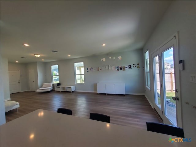 interior space featuring dark hardwood / wood-style floors and plenty of natural light