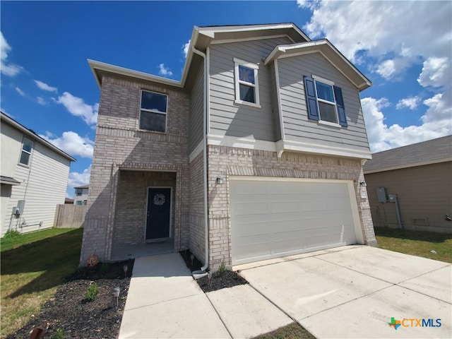 view of front of property with a garage and a front yard