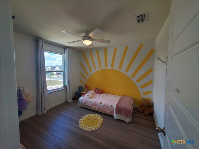 bedroom featuring ceiling fan and dark hardwood / wood-style floors