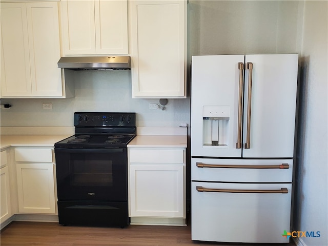 kitchen with white cabinets, hardwood / wood-style floors, white fridge with ice dispenser, and black / electric stove