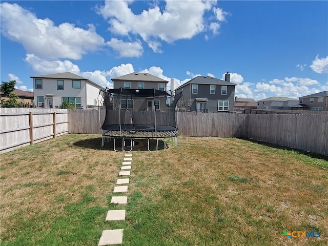 view of yard featuring a trampoline